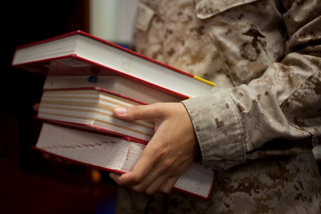 Soldier carrying books